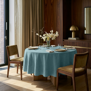 Aquamarine Blue Linen Round Tablecloth in a Warm Contemporary Dining Room with Walnut Paneling