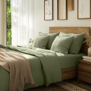 Asparagus Green Linen Fitted Sheet On The Bed