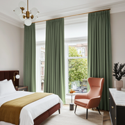 Asparagus Green Linen Pencil Pleat Curtains in a Bright White Bedroom with Warm Terracotta and Brass Accents - Blackout Lining
