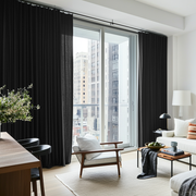 Black Linen S-Fold Curtains for Sliding Doors in a Bifold Room with Bright White Walls