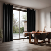Black Velvet Grommet Blackout Curtains for Sliding Doors in a Dining Room with Off-White Walls