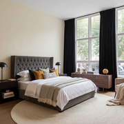 Black Velvet Pencil Pleat Blackout Curtains in a Bedroom with Cream Walls