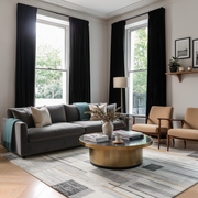 Black Velvet Pencil Pleat Blackout Curtains in a Living Room with White Walls