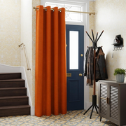 Burnt Orange Thermal Door Curtain in a Hallway with Yellow Patterned Wallpaper and a Blue Front Door