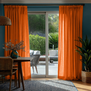 Burnt Orange Linen Pinch Pleat Curtains for Bifold Doors in a Dining Room with Blue Walls