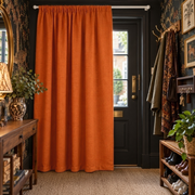 Burnt Orange Thermal Door Curtain in a Hallway with Black Botanical Wallpaper and a Dark Wood Console Table