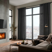 Charcoal Grey Linen Back Tab Curtains for Bifold Doors in a Living Room with Beige Walls