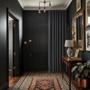 Charcoal Grey Thermal Door Curtain in a Hallway with Matte Black Walls 