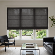 Charcoal Cordless Linen Roman Blinds in a Contemporary Living Room with White Walls and a Black Glass Coffee Table
