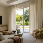 Cream Linen S-Fold Curtains for Bifold Doors in a Living Room with Beige Walls