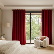 Dark Deep Red Velvet Grommet Blackout Curtains in a Bedroom with Beige Walls