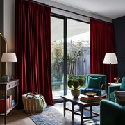Dark Deep Red Velvet Pencil Pleat Blackout Curtains for Bifold Doors in a Living Room with Charcoal Walls