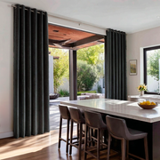 Dark Grey Velvet Eyelet Sliding Patio Door Curtains in a Modern Kitchen with a Marble Island