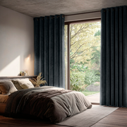 Dark Grey Velvet Eyelet Blackout Curtains for Sliding Doors in a Bedroom with Off-White Walls