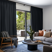 Dark Grey Velvet Pencil Pleat Blackout Curtains for Sliding Doors in a Living Room with White Walls