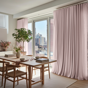 Dusty Pink Linen S-Fold Curtains for Bifold Doors in a Dining Room with Off-White Walls