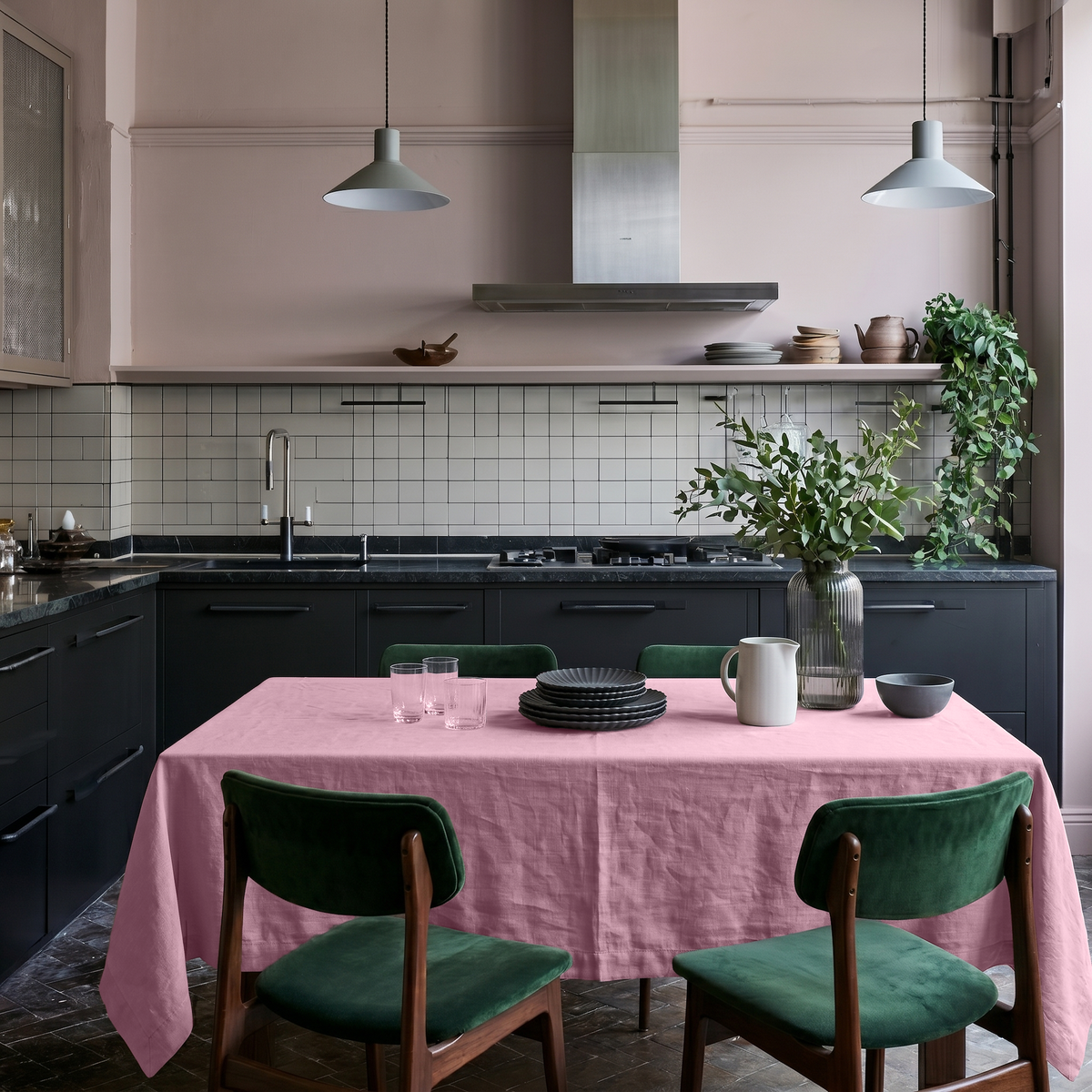 Dusty Rose Rectangular Linen Tablecloth in a Contemporary Kitchen with Black Cabinetry and Emerald Green Chairs