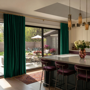 Emerald Green Velvet S-Fold Blackout Curtains for Sliding Doors in a Kitchen with Beige Walls