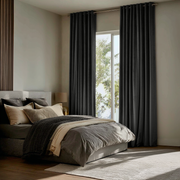 Dark Grey Velvet Eyelet Curtains in a Modern Bedroom with Layered Neutral Bedding