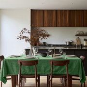 Fern Green Rectangular Velvet Tablecloth in a Contemporary Kitchen with Walnut Cabinetry and Wooden Dining Chairs