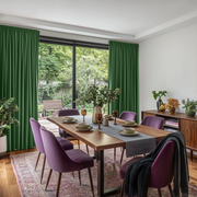 Fern Green Velvet Pencil Pleat Blackout Curtains for Sliding Doors in a Dining Room with Bright White Walls