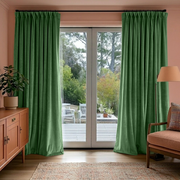 Fern Green Velvet Pinch Pleat Blackout Curtains for Sliding Doors in a Living Room with Peach Walls
