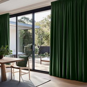 Forest Green Linen Pencil Pleat Curtains for Bifold Doors in a Dining Room with Beige Walls - Blackout Lining