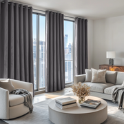 Grey Velvet Eyelet Blackout Curtains in a Living Room with White Walls