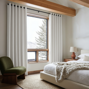 Off-White Heavy Weight Linen Eyelet Curtains in a Warm Neutral Bedroom With Beige Bedding and Exposed Wood Beams - Blackout Lining