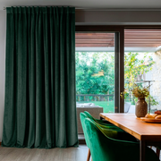 Hunter Green Velvet Back Tab Blackout Curtains for Sliding Doors in a Dining Room with Grey Walls