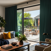 Hunter Green Velvet S-Fold Blackout Curtains for Sliding Doors in a Living Room with Beige Walls