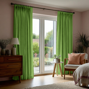 Light Green Velvet Pinch Pleat Blackout Curtains for Sliding Doors in a Bedroom with Beige Walls