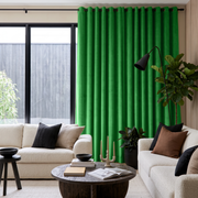 Lime Green Velvet Eyelet Curtains in a Contemporary Living Room with Cream Sofas and Black Accents