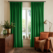 Lime Green Velvet Pinch Pleat Curtains in a Cozy Living Room with Beige Walls and a Brown Leather Armchair