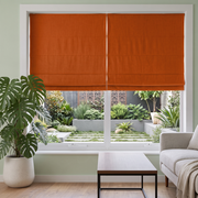 Burnt Orange Linen Cordless Roman Blinds in a Modern Bedroom