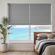Stone Gray Linen Cordless Roman Blinds in a Modern Bedroom with White Walls and a Wooden Bed Frame