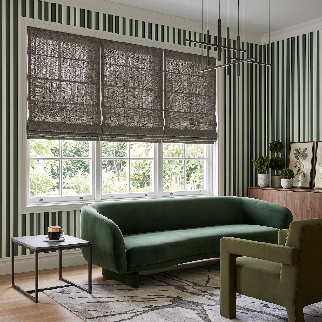 Heavy Natural Roman Blinds in a Modern Living Room with Green Striped Wallpaper and a Velvet Sofa