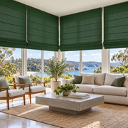 Forest Green Linen Cordless Roman Blinds in a Modern Living Room with White Walls and a Coffee Table