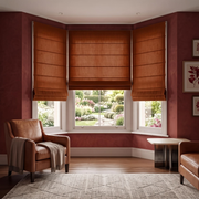 Terracotta Heavy Weight Linen Cordless Roman Blinds in a Classic Living Room with Deep Red Walls and Leather Armchair