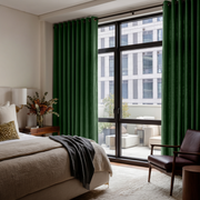 Forest Green Linen Eyelet Bedroom Curtains in a Contemporary Bedroom with Dark Leather Accent Chair and Charcoal Accents - Blackout Lining