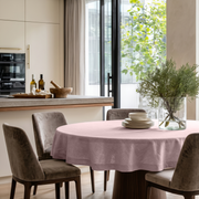 Dusty Pink Linen Round Tablecloth in a Modern Kitchen Dining Space with Cream Cabinetry and Taupe Velvet Chairs