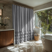 Stone Grey Linen Ruffle Shower Curtain in a Marble Bathroom
