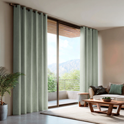 Mint Green Velvet Eyelet Blackout Curtains for Sliding Doors in a Living Room with Beige Walls