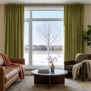 Moss Green Velvet Multitape Thermal Curtains in a Living Room with a Brown Leather Sofa
