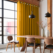 Mustard Yellow Linen Eyelet Curtains in an Industrial Dining Room with Black-Framed Windows and Exposed Wood Beams