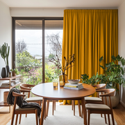 Mustard Yellow Linen Pencil Pleat Curtains for Bifold Doors in a Dining Room with White Walls - Blackout Lining