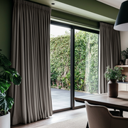 Natural Heavy Weight Linen Pencil Pleat Curtains for Sliding Door in a Modern Dining Room with Green Walls - Blackout Lining