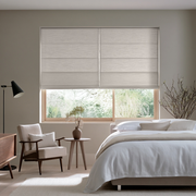 Natural Roman Blinds in a Minimalist Living Room with White Walls