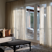 Natural Voile Linen S-Fold Curtains for Sliding Doors in a Living Room with Beige Walls