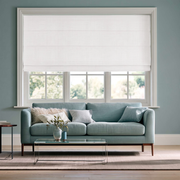 Heavy Off-White Roman Blinds in a Modern Living Room with Slate Blue Walls and a Blue Sofa